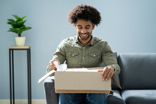Man Unpacking Received Parcel