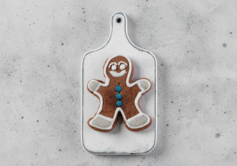 Gingerbread man on a wooden board