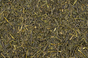 Sencha. Dried green tea leaves background