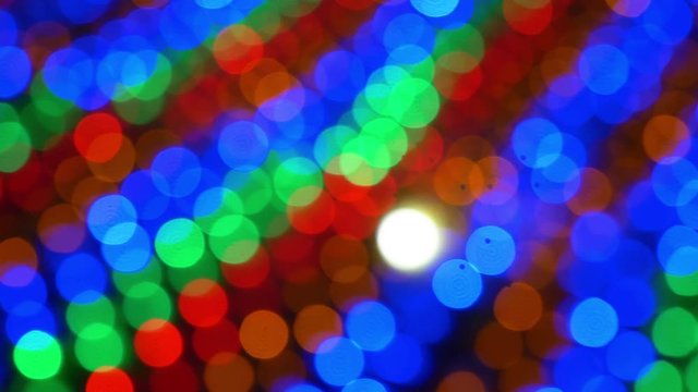 Abstract Light Bokeh Background.blur lights from Light bulbs sparkle circle lit celebrations display Christmas wallpaper decorations concept.Light effect many color move and blur in carnival festival.