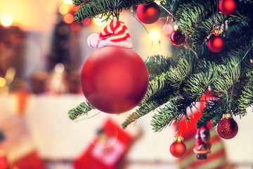 Christmas background - baubles and branch of spruce tree
