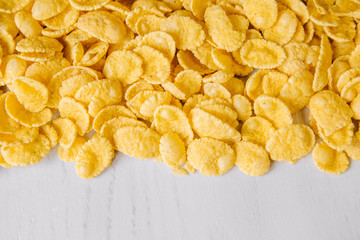 Cornflakes on white background. Top view. Place for your text