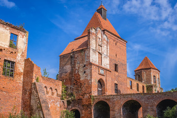 Fototapeta na wymiar View ont he tower gate and bridge of Teutonic Order castle in Szymbark, small village in Masuria region of Poland