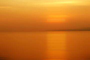 Abstract background motion blur sunset on the sea