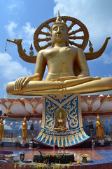 Big Buddha statue on Koh Samui on a background of blue sky with clouds.