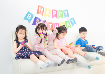 asian children group playing ribbon in birthday party, they feeling happy and cheerful, celebration and congratulation party