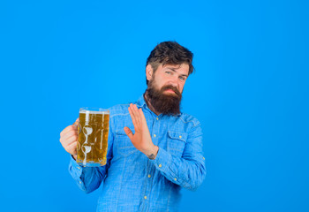 Craft beer at restaurant. Bearded man hold glass with craft ale. Beer in Germany. Alcohol. Beer time. Bearded man tasting fresh delicious beer. Oktoberfest. Holliday, drinks, alcohol, leisure concept.