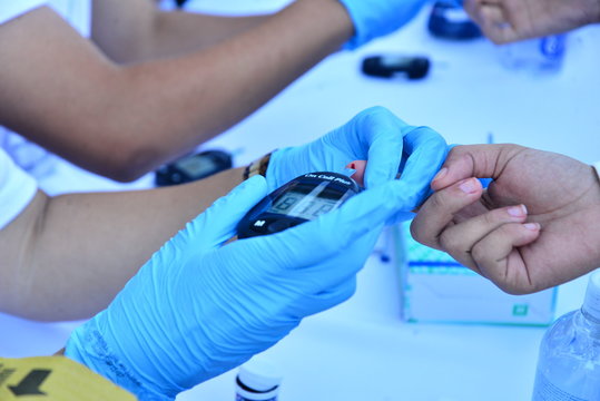 blood glucose test, prevention campaign, measuring blood glucose, world diabetes day, we take care of our health, diabetes control, glucose monitoring, blood glucose monitors, medical technology - Powered by Adobe