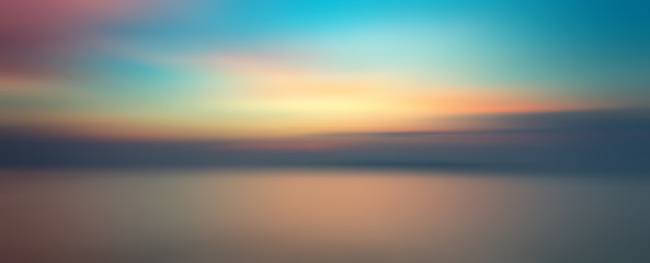 Motion blurred background of sunset on the sea