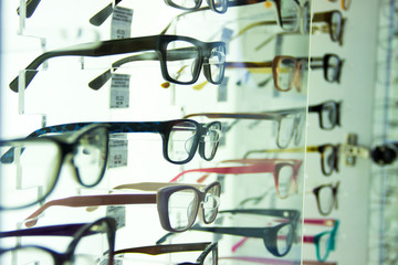 showcase with different spectacles, glasses