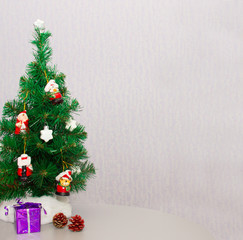 Christmas tree with toys, cones and gift. Close-up