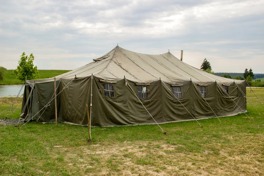 military tent in the the open countryside meadow