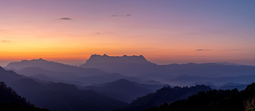 Panoramic mountain layers line at morning colorful sky background, landscape © AungMyo