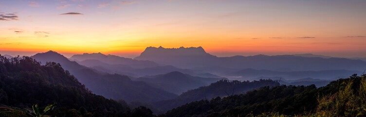 Panoramic mountain layers line at morning colorful sky background, landscape