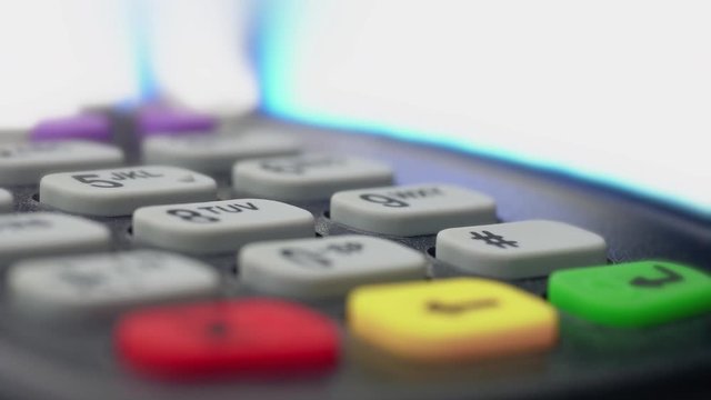 Credit card payment terminal, swiping for sale transaction. Close-up view.