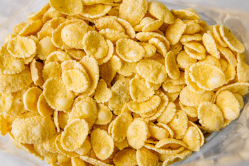 Cornflakes viewed from inside of the plastic bag. Top view. Place for your text