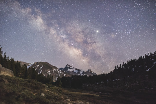 The Milky Way and Venus rising over the Sierra Mountains in Yosemite Valley, Tioga Pass, California