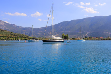 Sailing yachts moored near the island