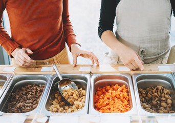 Buying products in zero waste shop or plastic free grocery store