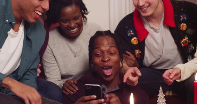 A group of friends gather around for a holiday selfie - shot on RED
