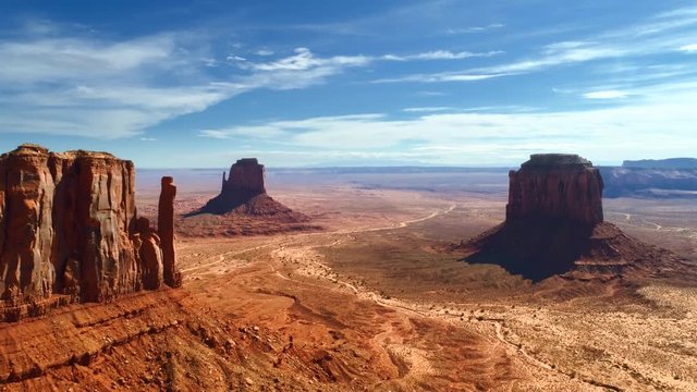 Aerial 4K view over the territory of Monument Valley Navajo Tribal Park. Amazingly beautiful landscape of the valley, familiar to everyone from the famous western movies, documentaries and commercials