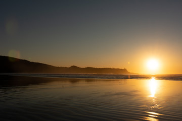 Fototapeta na wymiar beautiful sandy beach sunset in tofino bc