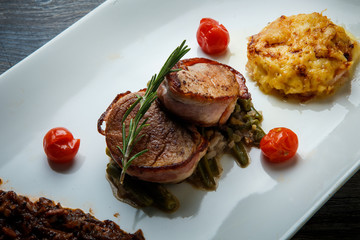 closeup trendy restaurant dish of roasted meat with mushroom sauce