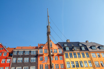 view of Architecture and boat masts of Nyhavn in Copenhagen 