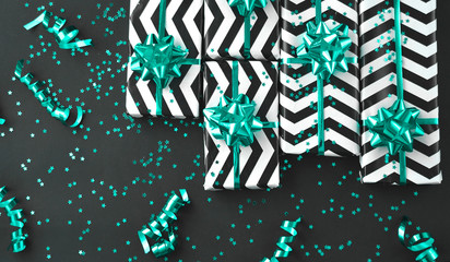 Gift box with ribbon on trendy mint color background.