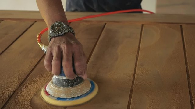 Woodworking. Sanding on wood in slow motion