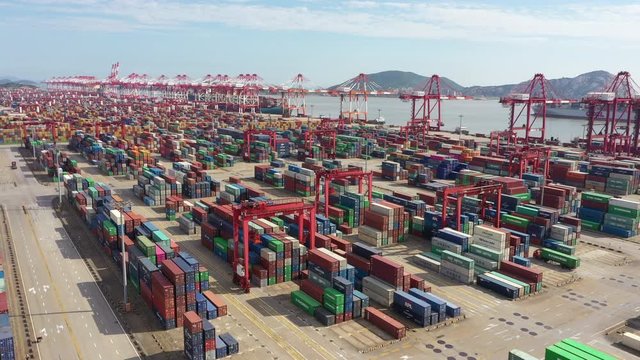 Low angle aerial view of container terminal in deep-water Port of Shanghai, overseas trade, shipping industry and globalization in China Asia