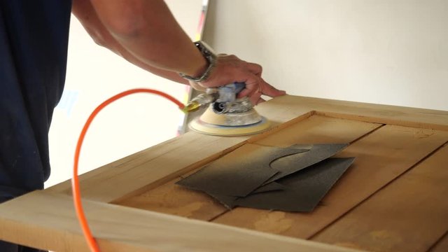 Woodworking. Sanding on wood in 4K resolution