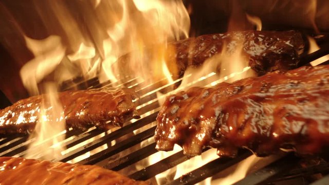 Ribs on flaming grill barbecued