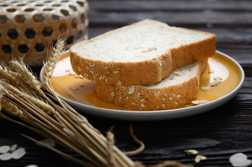 Fresh homemade  baked whole grain bread and sliced bread on wooden