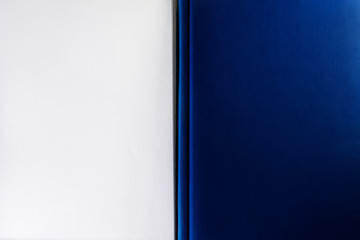 a closed blue Notepad on the side of the frame and a sheet of open blank Notepad