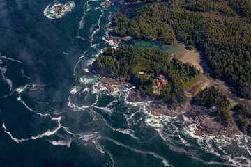 Aerial Landscape View of Beautiful Pacific Ocean Coast during a sunny summer morning. Taken at Pacific Rim National Park, South of Tofino and Ucluelet, Vancouver Island, British Columbia, Canada.