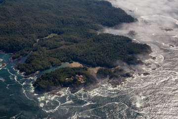Aerial Landscape View of Beautiful Pacific Ocean Coast during a sunny summer morning. Taken at Pacific Rim National Park, South of Tofino and Ucluelet, Vancouver Island, British Columbia, Canada.