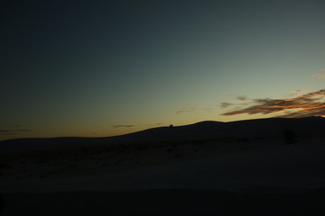 silhouette of the three people on the mountain 