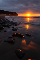 Naklejka na ściany i meble Seaside, Oregon Coast, United States of America. Beautiful View of a Rocky Beach on the Pacific Ocean during a dramatic summer sunset.