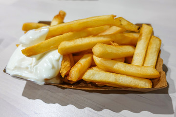 french fries in a paper plate