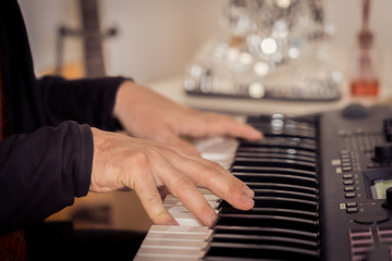 Hands playing piano