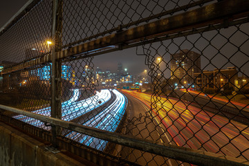 White and red light trails coming and going to downtown Chicago on a cloudy misty night viewed...