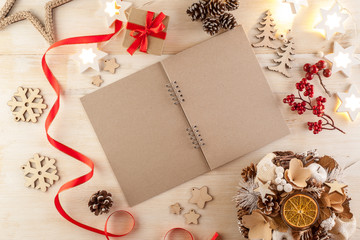 Open notebook in dark paper on a wooden table