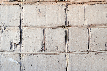 Old brick wall painted by gray paint closeup. Abstract background