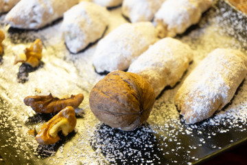 mini croissants with walnuts covered with icing sugar