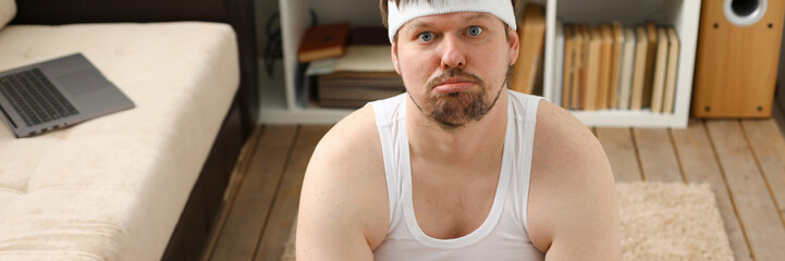 Obraz premium A young man practicing yoga and Pilates