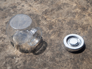 Empty glass jars on the cement floor for food or for the orderly and beautiful