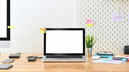 Workspace laptop computer on creative workplace with accessories creativity.