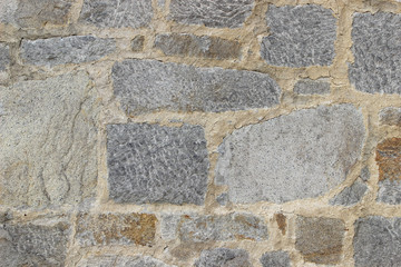 Wall made of natural rocks of different sizes and shapes