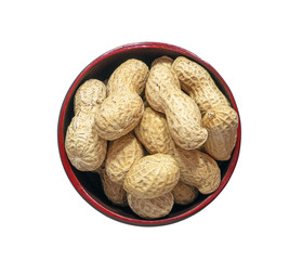Groundnut or peanut in the wooden red bowl isolated on white background.Top view and close up. Take photo at studio..